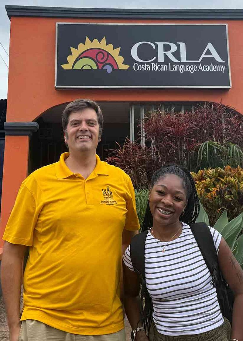 John Peterson, left, instructor of Spanish at UAPB, poses with Mari'Neisha Hardrick. Peterson said Hardrick was on track to be the first student to complete UAPB's Spanish minor program. (Special to The Commercial/University of Arkansas at Pine Bluff)