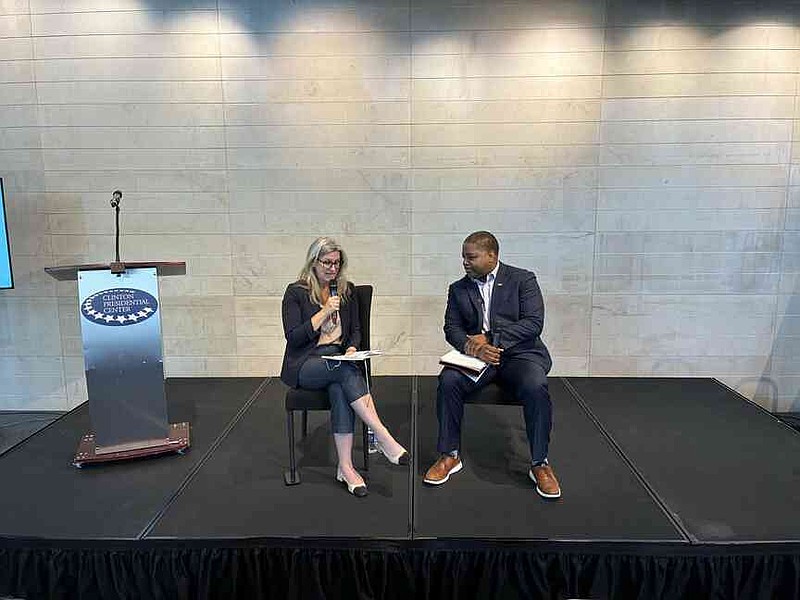 Kate Windsome poses a question to Christ Jones on Wednesday during the 13th Annual Whistleblower Summit & Film Festival, in Little Rock. (Pine Bluff Commercial/Byron Tate)