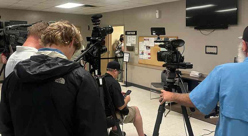 Media members crowd the lobby of the Washington County Detention Center courtroom in Fayetteville on Friday morning as Andrew James McGann has his first appearance before a judge in connection with two counts of capital murder. (NWA Democrat-Gazette/Ron Wood)