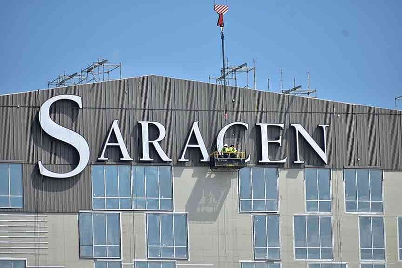 Crane workers install the logo for Saracen Casino Resort on Tuesday, Aug. 5, 2025. (Pine Bluff Commercial/I.C. Murrell)