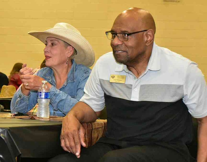 Watson Chapel High School counselor Bianca Pilewski, left, and career coach Carl Whimper chat at the end of the district convocation. (Pine Bluff Commercial/I.C. Murrell)