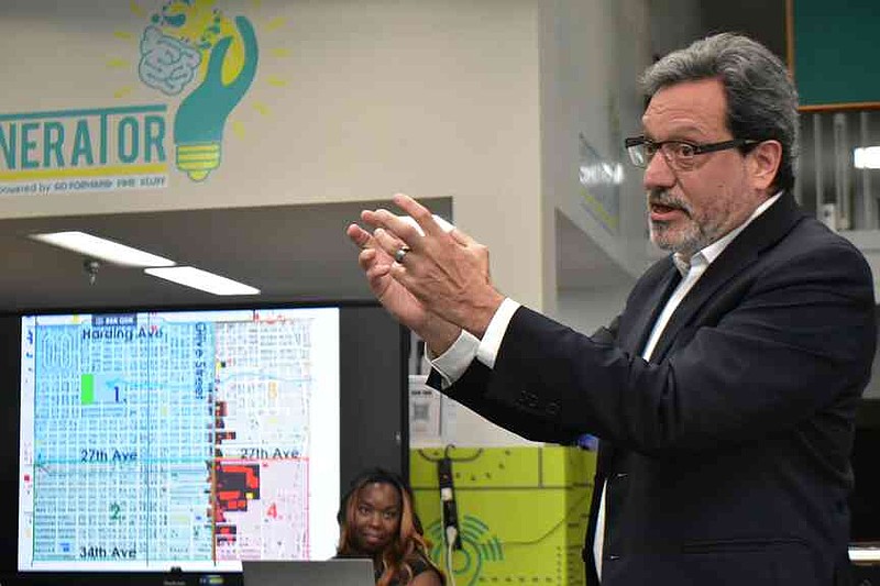 Stephen Luoni, chairman of architecture and urban studies at the University of Arkansas, Fayetteville, shows a map of Olive Street and parts of Pine Bluff at a community meeting at The Generator on Thursday, Aug. 7, 2025. (Pine Bluff Commercial/I.C. Murrell)