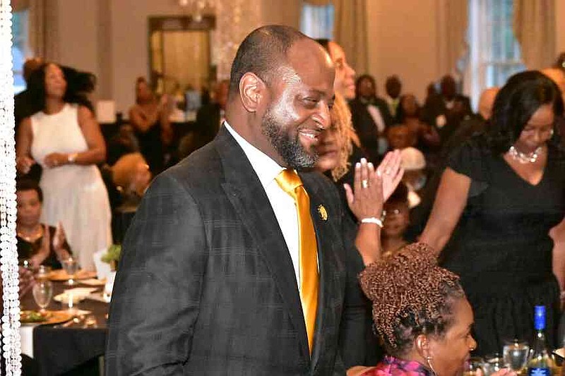 UAPB Chancellor Anthony Graham walks to the podium to a standing ovation. (Pine Bluff Commercial/I.C. Murrell)