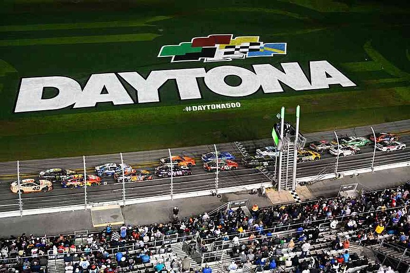 FILE - Drivers pass the start line after a caution during the NASCAR Daytona 500 auto race at Daytona International Speedway, Feb. 16, 2025, in Daytona Beach, Fla. (AP Photo/Phelan M. Ebenhack, File)