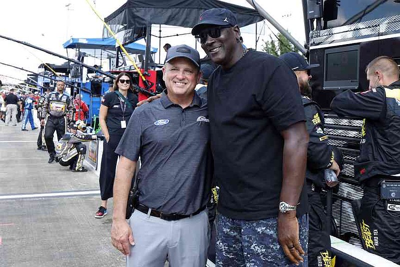 FILE - Bob Jenkins, owner of Front Row Motorsports and Co-Owner Michael Jordan, of 23XI Racing, pose before a NASCAR Cup Series auto race at Talladega Superspeedway, Oct. 6, 2024, in Talladega, Ala. (AP Photo/ Butch Dill, File)