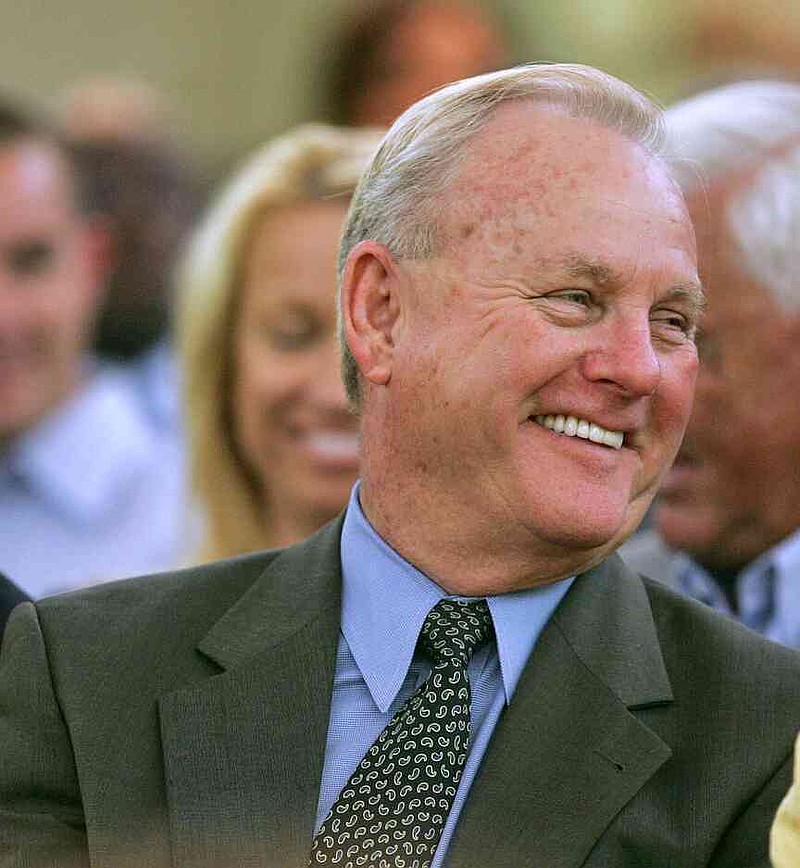 FILE - H.A. 'Humpy' Wheeler, right, president of Lowe's Motor Speedway smiles during a joint session of the General Assembly in the Senate Chamber May 10, 2005 in Raleigh, N.C. (AP Photo/Gerry Broome, file)