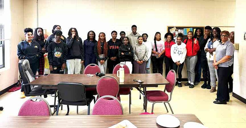 Karleah Harris, right, associate professor for the University of Arkansas at Pine Bluff Department of Human Sciences, works with participants at Watson Chapel Junior High School. (Special to The Commercial/University of Arkansas at Pine Bluff)