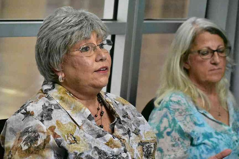 Sheri Storie (left), executive director of the Pine Bluff Advertising and Planning Commission, explains data she uses in tracking Convention Center visitors as administrative assistant Betty Brown listens Tuesday, Aug. 26, 2025. (Pine Bluff Commercial/I.C. Murrell)