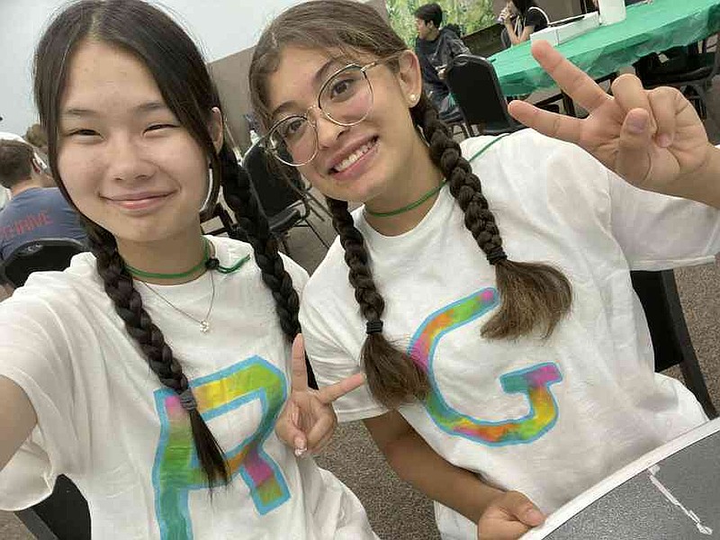Gabriella Pardo, a member of Texas 4-H is shown with her family's Japanese exchange student, Rumino Miyaura. Both attended the International 4-H Camp. (Special to The Commercial/University of Arkansas System Division of Agriculture)
