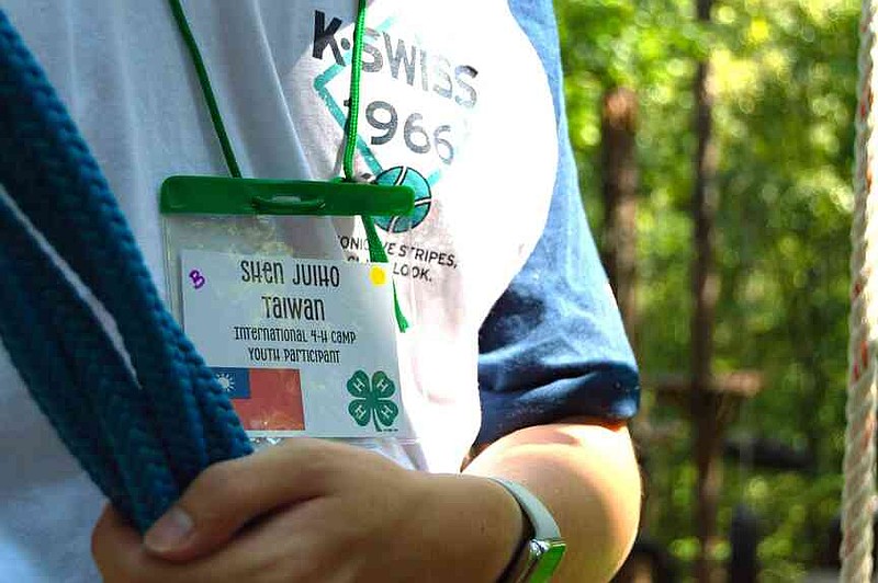 A camper displays their name tag during the International 4-H Camp held Aug. 7-13 at the C.A. Vines Arkansas 4-H Center in Little Rock. (Special to The Commercial/University of Arkansas System Division of Agriculture)