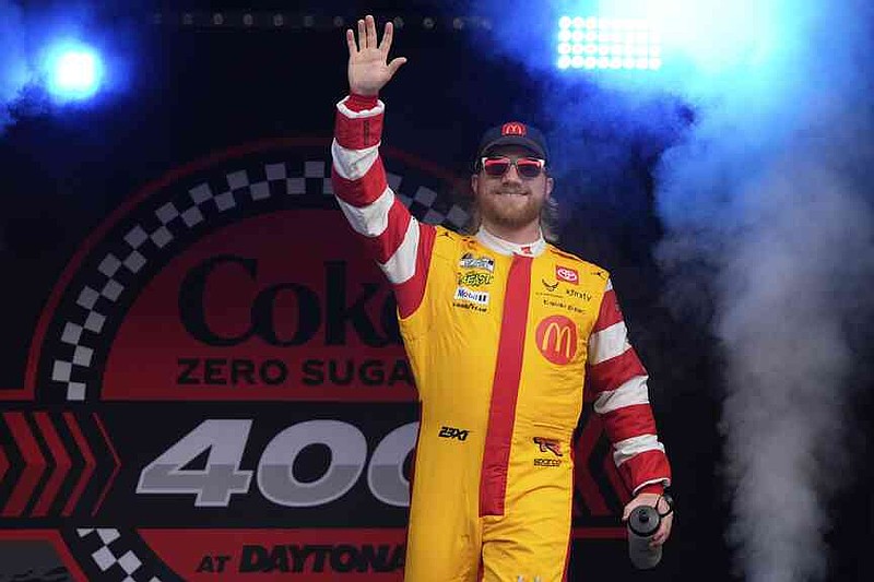 Tyler Reddick waves to fans during driver introductions before the NASCAR Cup Series auto race at Daytona International Speedway, Aug. 23, 2025, in Daytona Beach, Fla. (AP Photo/John Raoux)