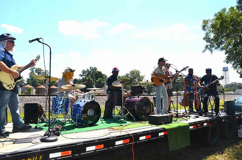 Wabbaseka native son Billy Jeter donated live music along with his Shine Eye Band. From left: Jason Lee Hale from England on lead guitar, Dave Hoffpauir from Shreveport and Marquis Boyd from Pine Bluff on drums, Billy Jeter on rhythm guitar and lead vocals, Lynn Fitzgerald from North Little Rock on bass, Darius Blanton from Little Rock on keyboard and special guest Detroit Johnny Johnson from Pine Bluff on accompanying lead guitar. (Special to The Commercial/Richard Ledbetter)