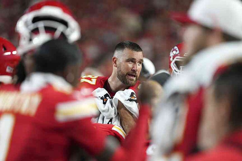 Kansas City Chiefs tight end Travis Kelce is seen in the bench area during the first half of a preseason NFL football game against the Chicago Bears Friday, Aug. 22, 2025, in Kansas City, Mo. (AP Photo/Ed Zurga)