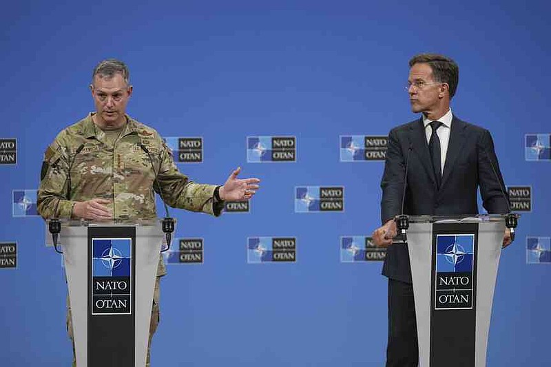NATO Secretary General Mark Rutte, right, and Supreme Allied Commander Europe (SACEUR), General Alexus G. Grynkewich address the media at NATO headquarters in Brussels, Friday, Sept. 12, 2025. (AP Photo/Virginia Mayo)