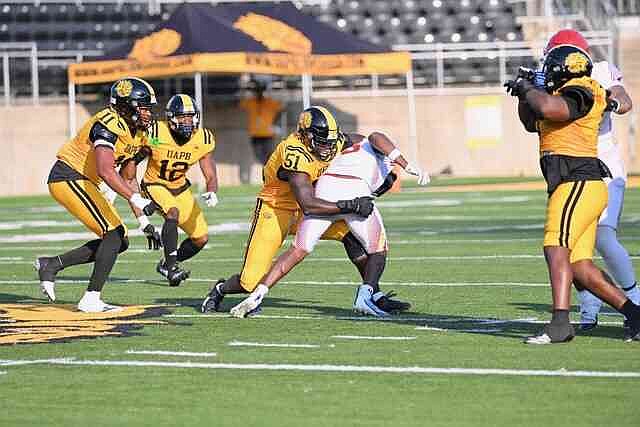 UAPB linebacker Mohammed Kelleh wraps up Lincoln running back El Arnold. (Special to the Commercial/William Harvey)