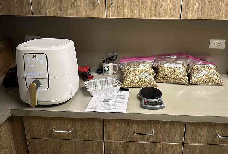 An air fryer works while other samples sit bagged on a counter. (Special to The Commercial/Brian Haller/University of Arkansas System Division of Agriculture)