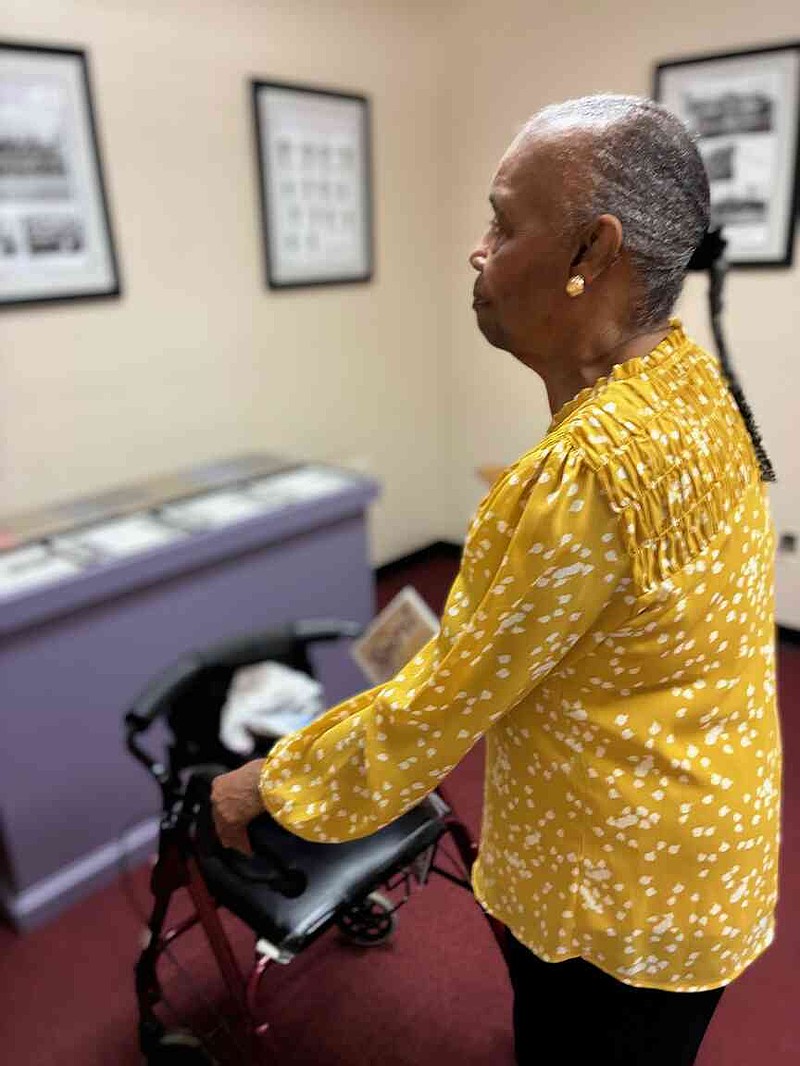 Maxine Lamb Vaughn, Class of 1956, scans the walls at the newly opened Merrill Historical Museum on Thursday. 'This is very special,' she said. (Pine Bluff Commercial/Byron Tate)