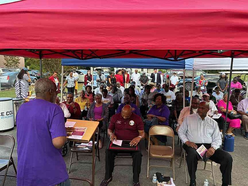 Visitors gather Thursday during the grand opening remarks for the Merrill Historical Museum. (Pine Bluff Commercial/Byron Tate(