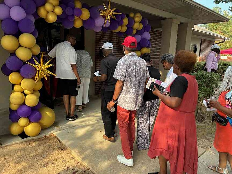 Visitors stream into the newly opened Merrill Historical Museum. (Pine Bluff Commercial/Byron Tate)