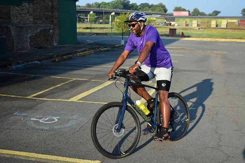 John Proctor of Pine Bluff rides into the Arkansas Railroad Museum in the early moments of his 63-mile path of Tour de Bluff. (Pine Bluff Commercial/I.C. Murrell)