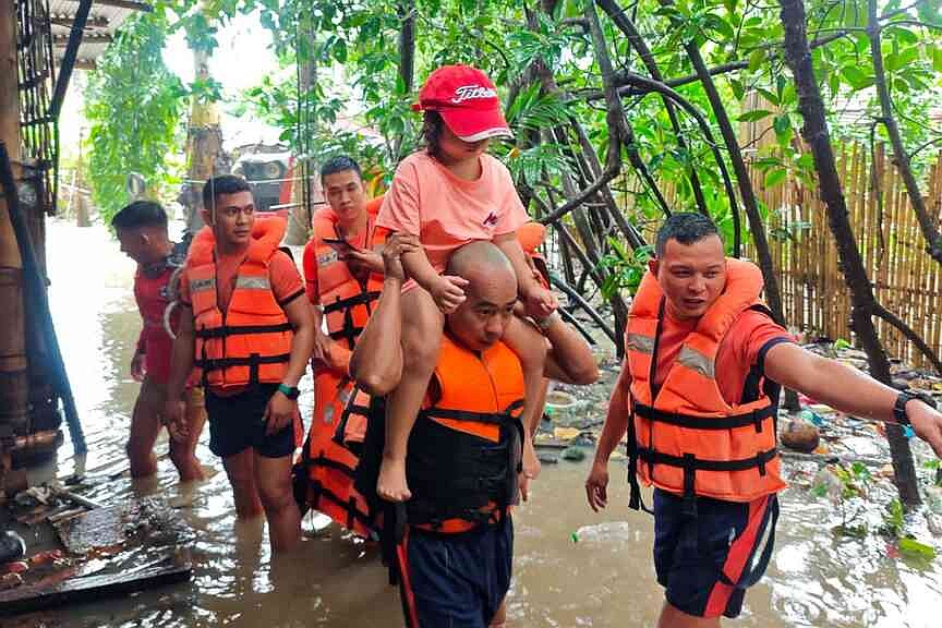 Storm blows out of Philippines, leaving 10 dead; thousands flee