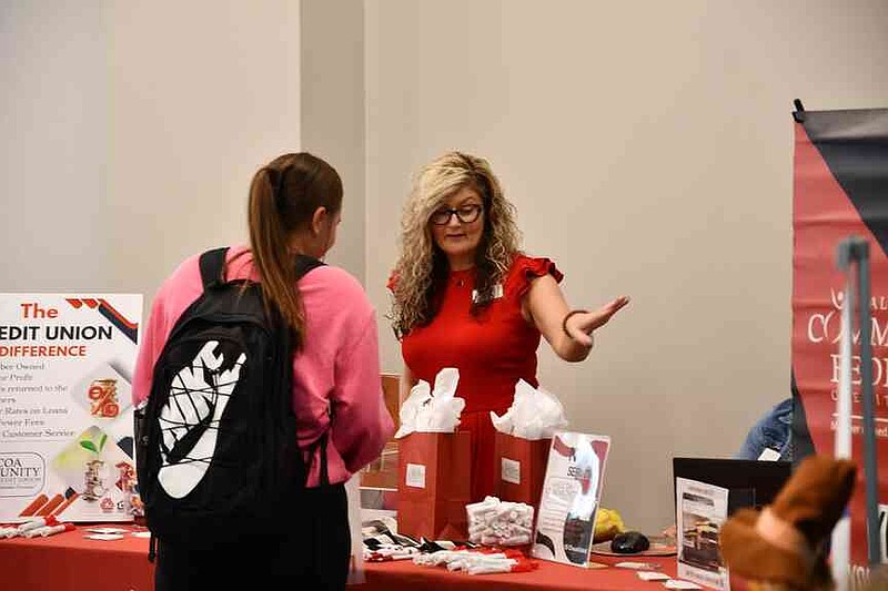A student at National Park College talks with a representative from Alcoa Community Federal Credit Union during the college's inaugural Experience Expo on Sept. 9 in the NPC Student Commons. (Courtesy NPC)