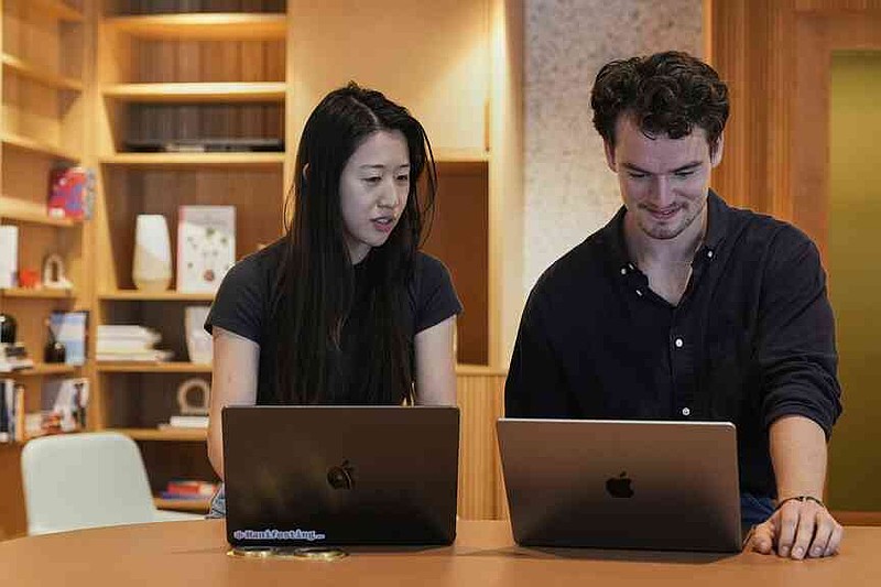 Claude code product manager Cat Wu, left, and Alex Albert, head of Claude relations, work inside Anthropic headquarters in San Francisco, Wednesday, Aug. 27, 2025.