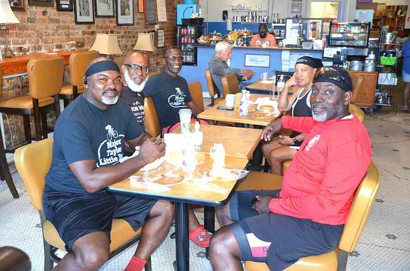 Members of the Major Taylor Cycling Club relaxed in Indigo Blue Coffeehouse following their 21.6 mile bicycle tour of Pine Bluff. (Special to The Commercial/Richard Ledbetter)