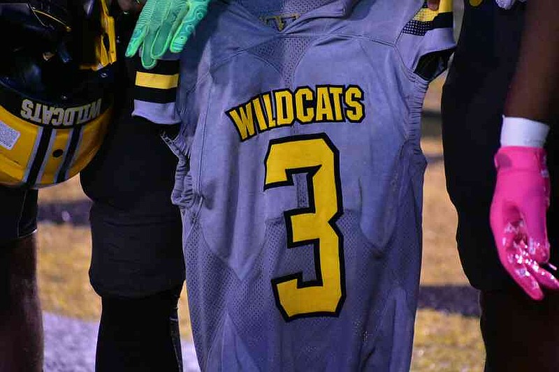 Taariq Conner's No. 3 jersey from his playing days at Watson Chapel is carried onto the field. (Pine Bluff Commercial/I.C. Murrell)