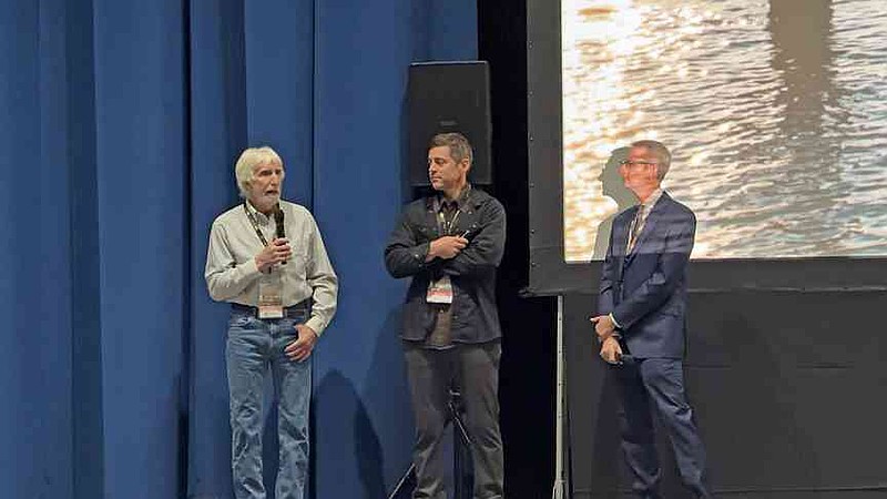 Rick Beattie, left, one of the subjects of the film Lost Wolves of Yellowstone, answers a question following a screening of the film as the film's director, Tom Winston and Hot Springs Documentary Film Institute Executive Director Ken Jacobson look on. (The Sentinel-Record/James Leigh)