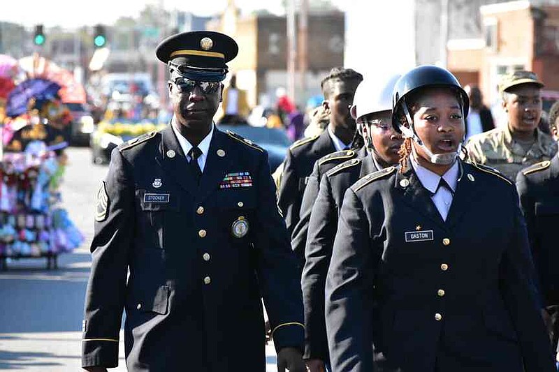 Sgt. First Class Jimmy Stocker guides the Watson Chapel Junior ROTC up Main Street. (Pine Bluff Commercial/I.C. Murrell)