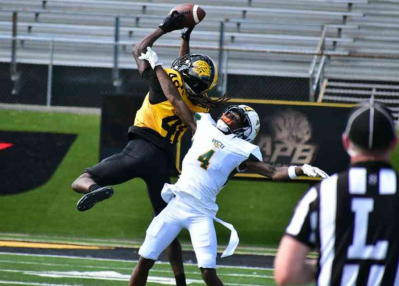 UAPB defensive back Akeem Rahsaan intercepts a pass intended for Westgate Christian receiver Kiram Dallas in the first quarter. (Pine Bluff Commercial/I.C. Murrell)