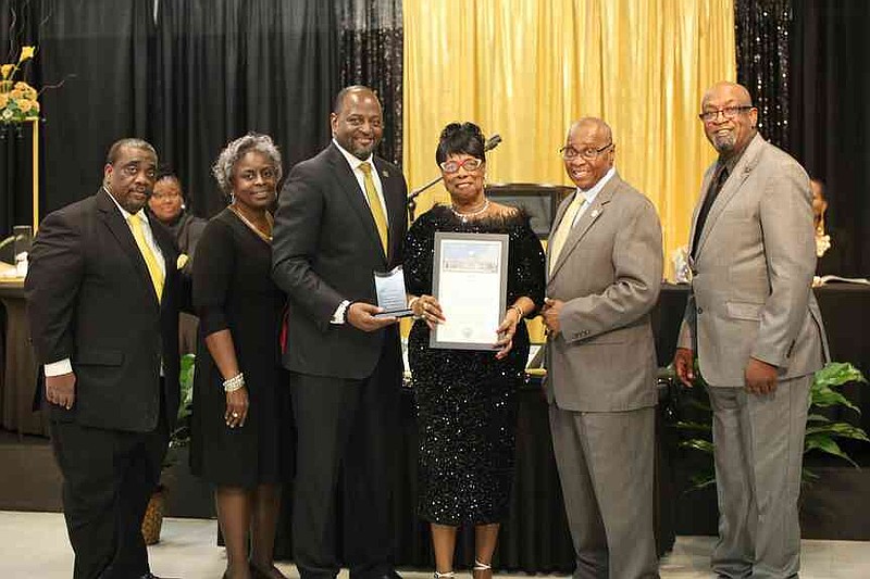 Dorothy Chapman-Brown, center, was honored for education. Six people were honored for their outstanding service. (Special to The Commercial/The Heat Magazine)