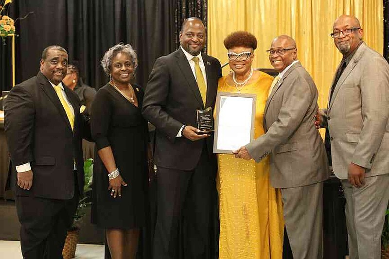 Janice L. Roberts, center, was honored for government. Six people were honored for their outstanding service. (Special to The Commercial/The Heat Magazine)