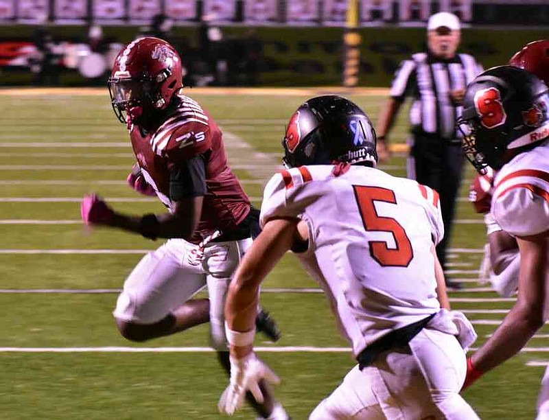 Kevin Pope of Pine Bluff takes a direct snap and runs for two points against Searcy on Friday, Oct. 17, 2025, at Simmons Bank Field at Golden Lion Stadium. (Pine Bluff Commercial/I.C. Murrell)