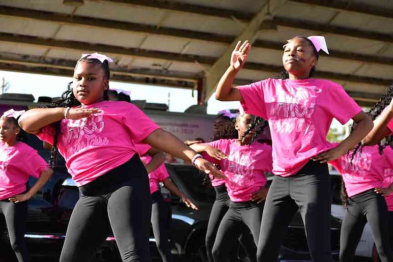 The dance team from the 34th Avenue Rhythm of the Drums drumline perform outside Saracen Pavilion. (Pine Bluff Commercial/I.C. Murrell)