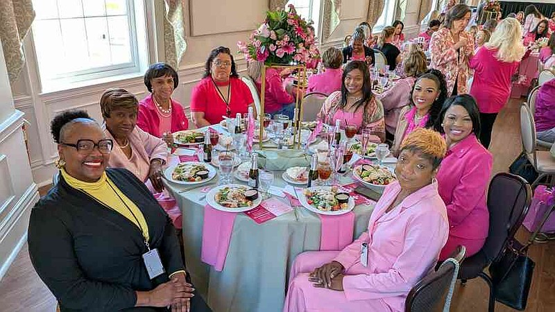 Clockwise from bottom left: Pine Bluff Mayor Vivian Flowers, Wanda Neal, Classie Jones-Green, Rosetta Marrow, Lakya Smith, Olandera Dunn, Barbara Dunn and Regina Jones attend the Pretty in Pink! luncheon. (Pine Bluff Commercial/I.C. Murrell)