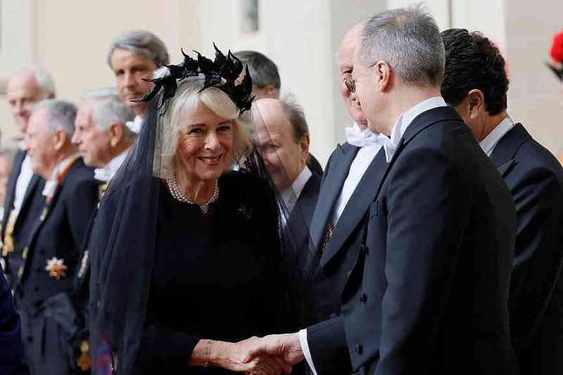 Britain's Queen Camilla arrives with King Charles III in the St. Damasus Courtyard at the Vatican for a state visit, where they will meet with Pope Leo XIV and pray with him in the Sistine Chapel, Thursday, Oct. 23, 2025. (Cecilia Fabiano/LaPresse via AP)