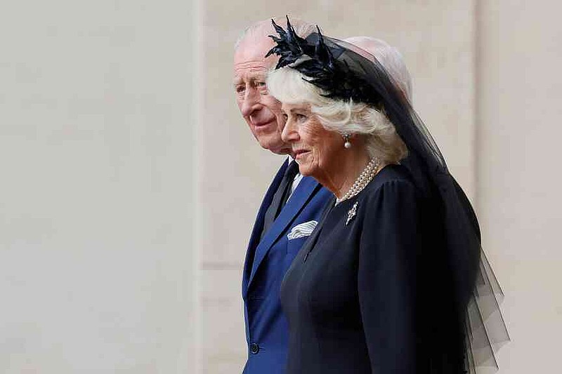 Britain's Queen Camilla, foreground arrives with King Charles III in the St. Damasus Courtyard at the Vatican for a state visit, where they will meet with Pope Leo XIV and pray with him in the Sistine Chapel, Thursday, Oct. 23, 2025. (Cecilia Fabiano/LaPresse via AP)