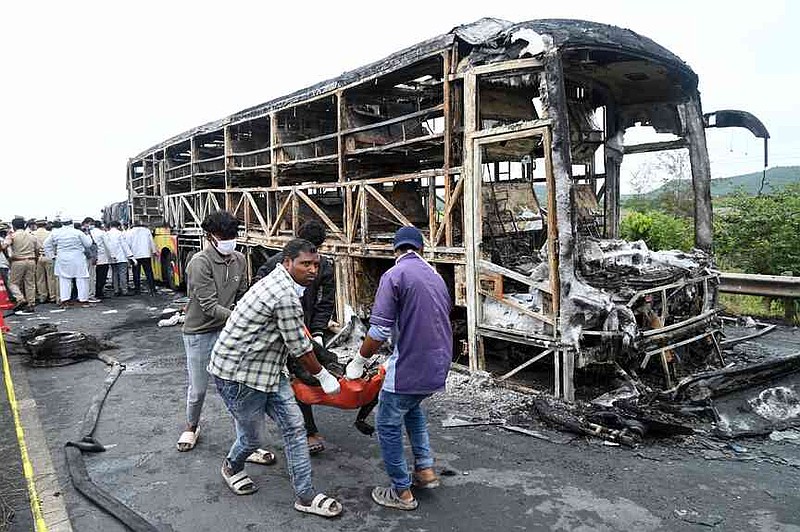 Bus explosion in India kills at least 25 2 Volunteers remove a dead body from the debris of a passenger bus which caught fire early Friday after a collision with a motorbike on a highway, in Chinnatekuru village, near Kurnool district in Andhra Pradesh state, India, Friday, Oct. 24, 2025. (AP Photo)