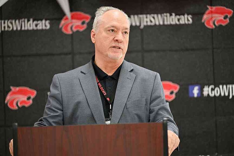 Tim Sparacino, Washington Junior High School principal, speaks Tuesday during a ceremony announcing the school becoming the sixth parent-choice school in the Bentonville School District at the school in Bentonville. Each Bentonville parent-choice school has themed programming, such as arts or leadership development, that is integrated into the curriculum. Visit nwaonline.com/photo for today's photo gallery. (NWA Democrat-Gazette/Caleb Grieger)