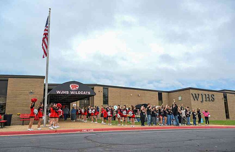 Students and school officials celebrate Tuesday during a ceremony announcing that Washington Junior High School will become the sixth parent-choice school in the Bentonville School District at the school in Bentonville. Each Bentonville parent-choice school has themed programming, such as arts or leadership development, that is integrated into the curriculum. Visit nwaonline.com/photo for today's photo gallery. (NWA Democrat-Gazette/Caleb Grieger)