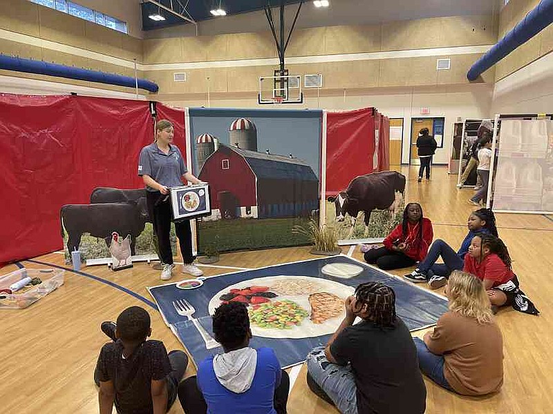 Anna Grace McCarty, extension agriculture agent for Pulaski County, shares with students the journey food takes from the farm to the plate. (Special to The Commercial/University of Arkansas System Division of Agriculture)