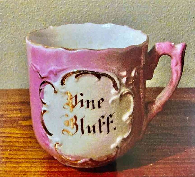 Paul Perdue's collection includes hundreds of Pine Bluff-centric items such as this decorative coffee cup. (Special to The Commercial/Paul Perdue)
