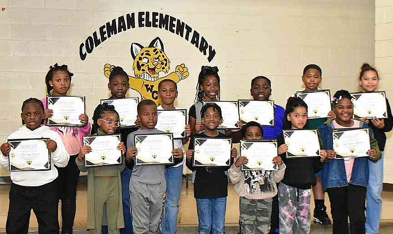 Coleman Elementary students who scored Level 3 or 4 in English language arts or math receive certificates during a community meeting on campus Thursday, Nov. 6, 2025. (Pine Bluff Commercial/I.C. Murrell)