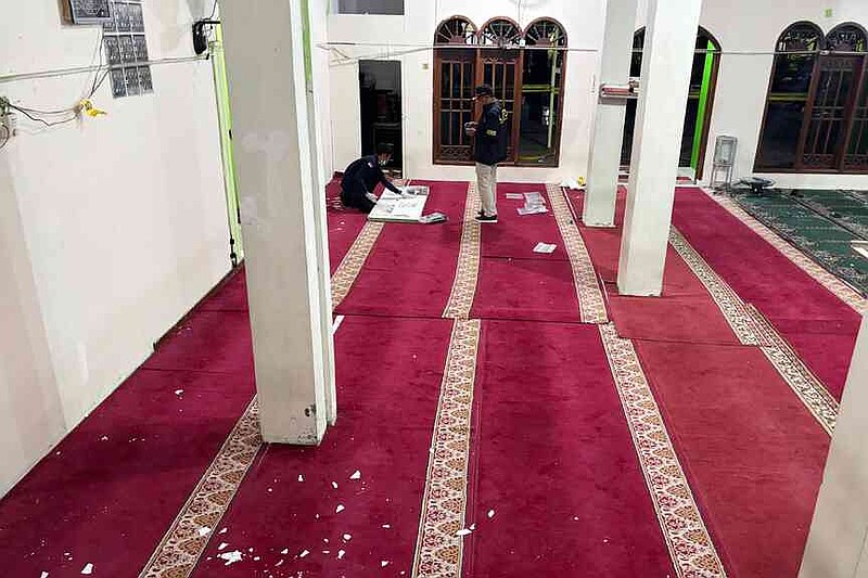 Members of Indonesian Police bomb squad inspect the mosque where explosions went off at a high school compound in Jakarta, Indonesia, Friday, Nov. 7, 2025. (AP Photo/Fadlan Syam)