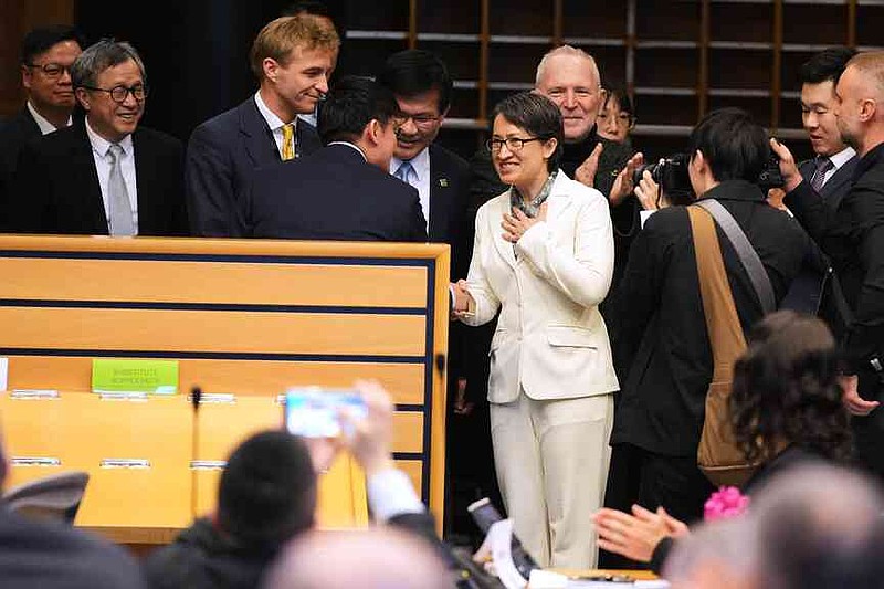 Taiwan’s Vice President Bi-Khim Hsiao, center, is greeted as she arrives to address an event at the European Parliament in Brussels, Friday, Nov. 7, 2025. (AP Photo/Virginia Mayo)