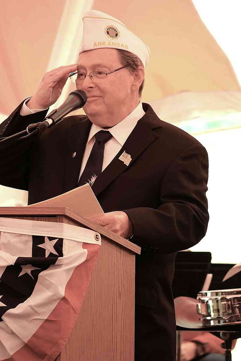 Glen Minor, retired U.S. Air Force helicopter pilot, salutes all veterans at the Veterans Day event at White Hall. (Special to The Commercial/Deborah Horn)
