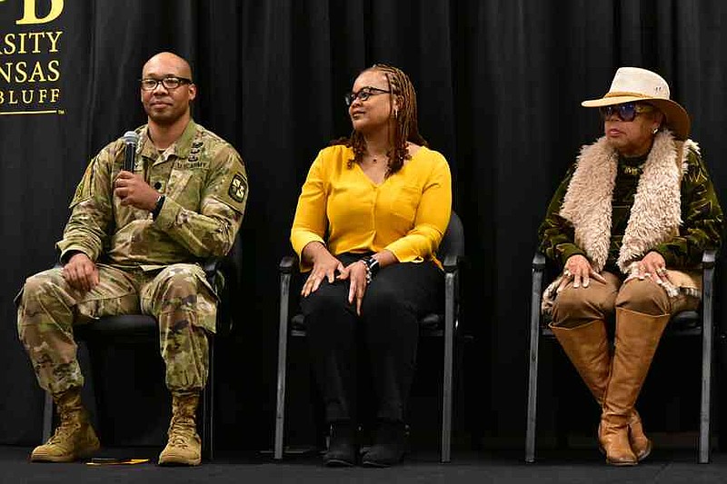 Lt. Col. Brian Waddy, professor of military science at the University of Arkansas at Pine Bluff, introduces himself as Army veteran Jalina Williams, center, and Air Force veteran Sheila Waddell listen during a Veterans Day Celebration on campus Tuesday, Dec. 11, 2025. (Pine Bluff Commercial/I.C. Murrell)