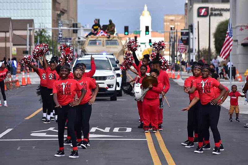 The 34th Avenue Elementary School Rhythm of the Drums and Drill Team march down Main Street Pine Bluff during the Pine Bluff Regional Veterans Parade on Saturday, Nov. 15, 2025. (Pine Bluff Commercial/I.C. Murrell)